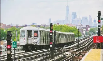  ??  ?? In this file photo, a subway approaches Brooklyn’s Bay Street above ground station with the New York City skyline in the background. On July 25, Metropolit­an Transporta­tion Authority Chairman Joseph Lhota unveiled an $836 million plan to
stabilize the...