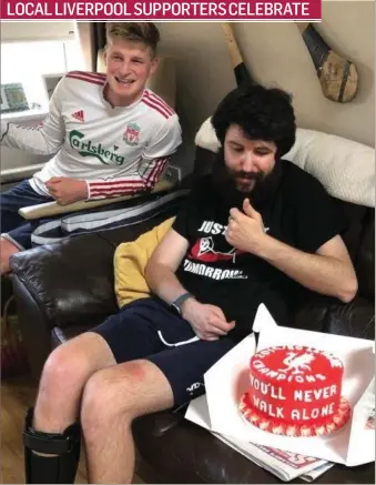  ??  ?? Luke O’Callaghan and Shane Vickers got together to eat some Liverpool cake as they celebrated Liverpool FC winning the Premier League last Thursday night. LOCAL LIVERPOOL SUPPORTERS CELEBRATE