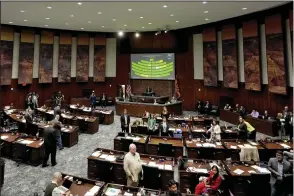  ?? (AP/Matt York) ?? Arizona state representa­tives convene Wednesday on the House floor at the Capitol in Phoenix, Ariz