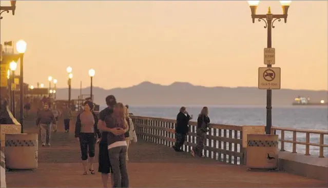  ?? Don Kelsen Los Angeles Times ?? THE CITY HAS California’s second-longest wooden pier. In the early 1900s, the pier was the setting for the Joy Zone, Orange County’s first seaside amusement park.