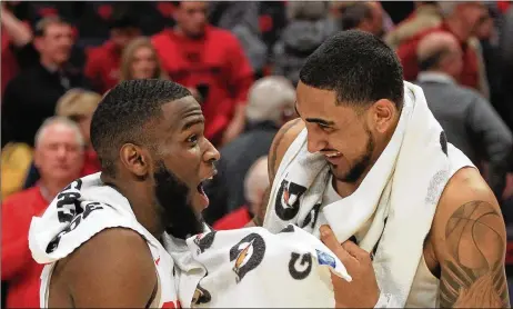  ??  ?? Dayton’s Jalen Crutcher and Obi Toppin smile after a victory against Virginia Commonweal­th on Jan. 14 at UD Arena.