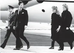  ??  ?? 1988
Tormented by grief, Charles, Diana and a pregnant Duchess of York fly back to London with Major Hugh Lindsay’s body after an avalanche struck the royal party.