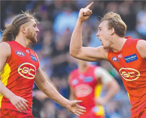  ?? Picture: AAP IMAGE ?? Tom Lynch (right) and Aaron Young celebrate a goal during the Suns’ win. But is the strong start a false dawn?