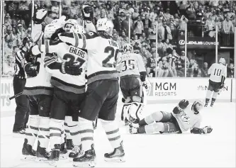  ?? MARK HUMPHREY THE ASSOCIATED PRESS ?? Winnipeg players celebrate after tying the game against the Predators on Sunday in Nashville, Tenn. The Predators won, 5-4, to split the first two games in the best-of-seven playoff series in Nashville.