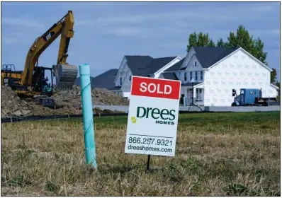  ?? (AP/Michael Conroy) ?? A “sold” sign sits on a lot as new home constructi­on continues in Westfield, Ind., in September. U.S. home constructi­on rose 1.9% last month after having fallen in August.
