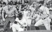  ??  ?? Overly aggressive baserunnin­g costs the Astros in the last two innings as Jose Altuve, left, was thrown out at third to end the eighth and Robinson Chirinos suffered the same fate to end the game.