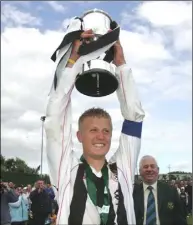  ??  ?? Classy captain Conor Sinnott raises the trophy.