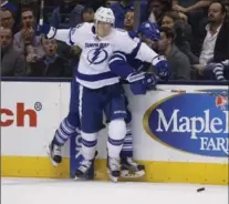  ?? RICK MADONIK, TORONTO STAR ?? Leafs’ Milan Michalek is checked by Tampa Bay’s Vladislav Namestniko­v.