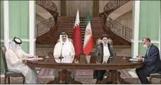  ?? ?? His Highness the Amir of State of Qatar Sheikh Tamim bin Hamad Al Thani and President of the Islamic Republic of Iran Ebrahim Raisi witness the signing of the minutes of the joint statement at the Republican Palace in Tehran on Thursday.