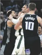  ?? PAUL KITAGAKI JR./THE SACRAMENTO BEE ?? Kings forward Trey Lyles, left, and Bucks center Brook Lopez fight in Sacramento on Monday.