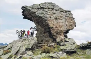  ?? PHOTO: MOUNTAINBI­KERS OF ALEXANDRA ?? Scenic course . . . Central Otago mountainbi­kers (from left) Ben Wearing, Thomas Begg, Cam Moir and Felix Schaap admire Sphinx Rock at the opening of the Sphinx Rock Track on Saturday.