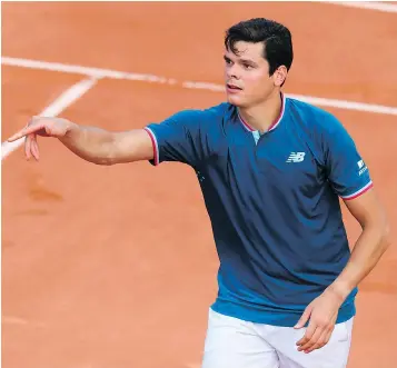  ?? — GETTY IMAGES ?? Canada’s Milos Raonic throws his wristband during his match against Brazil’s Rogerio Dutra Silva at the 2017 French Open in Paris on Wednesday.