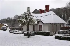  ?? Photo by Michelle Cooper Galvin ?? The Deenagh Lodge in Killarney’s National Park watched over by a large Snowman on Friday.