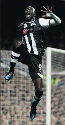  ?? — GETTY IMAGES ?? Papiss Cisse of Newcastle celebrates after scoring the opening goal during the match against Chelsea at Stamford Bridge on Wednesday.