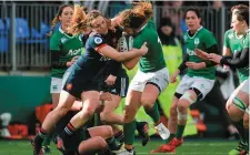  ?? Photo: Sam Barnes ?? Jenny Murphy of Ireland is tackled by Elodie Poublan of France during the Six Nations clash.