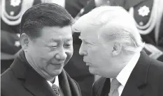  ?? (AP Photo/Andy Wong, File) ?? FILE - In this Nov. 9, 2017, file photo, U.S. President Donald Trump, right, chats with Chinese President Xi Jinping during a welcome ceremony at the Great Hall of the People in Beijing.