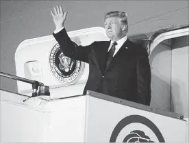  ?? EVAN VUCCI THE ASSOCIATED PRESS ?? U.S. President Donald Trump arrives at the Paya Lebar Air Base in Singapore on Sunday for the summit.