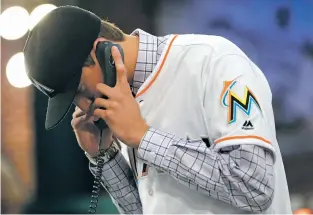  ?? JULIO CORTEZ/THE ASSOCIATED PRESS ?? Carlsbad, N.M., high school left-handed pitcher Trevor Rodgers talks to a member of the Marlins Monday after being selected No. 13 by Miami in the first round of the MLB draft in Secaucus, N.J.