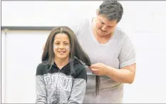  ?? CAROLE MORRIS-UNDERHILL ?? Tenya Sparks, wearing West Hants Middle School glittery facepaint for spirit day, was all smiles as she donated her ponytail.