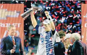  ?? ROB CARR/GETTY IMAGES ?? Tom Brady earned his 3rd MVP award and the Patriots secured their fourth championsh­ip after beating the Seahawks 28-24 in Super Bowl XLIX last year in Glendale, Ariz.