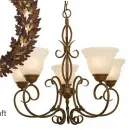  ??  ?? Denai painted vase with lid R499, Coricraft
Toledo five-light chandelier R2 299, The Lighting Warehouse