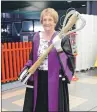  ?? Photograph­s: Iain Ferguson, The Write Image. ?? Jessie Gourlay had the honour of carrying the UHI Mace into the graduation ceremony.