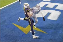  ?? CHARGERS’ DONALD PARHAM JR. Gina Ferazzi Los Angeles Times ?? appears to catch the winning touchdown on the f inal play against the Raiders on Nov. 8, but the call was overturned.