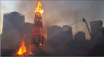  ?? Photo: Nampa/AFP ?? Torched… View of the church of Asuncion in flames after being set on fire by demonstrat­ors.