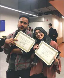  ??  ?? NU-Q graduates Zaki Hussain and Neha Rashid who won awards for their short film, Terima Kasih, and documentar­y Kiln at Northweste­rn’s annual research expo on the home campus in the US.