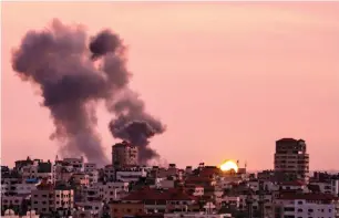  ?? AFP ?? Smoke billowing in Gaza City after Israel’s military targeted Hamas posts in Gaza. —