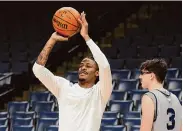  ?? George Walker IV/Associated Press ?? Guard Ja Morant, left, has been “leaning into the team a lot,” Grizzlies coach Taylor Jenkins said.