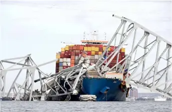  ?? AFP/VNA Photo ?? The scene of the disaster at Francis Scott Key bridge in Baltimore, Maryland, US. The disaster occurred at dramatic speed as the ship, piled high with containers, slammed into one of the bridge supports.