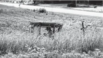  ?? Eamon Queeney / New York Times ?? A tractor works a soybean field in Goldsboro, N.C. President Donald Trump’s $16 billion bailout for U.S. farmers hurt by the trade war follows $12 billion in aid he provided them last year.