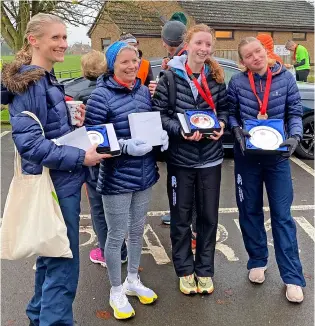  ?? PICTURES: Team Bath AC ?? Team Bath AC’S winning team at the Bromham Christmas Pub 10k road race, from left, Jenny Carter, Jo Thompson, Ella Treby and Freya Spruit