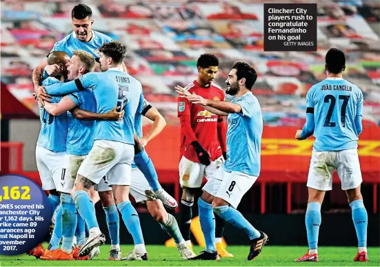  ?? GETTY IMAGES ?? Clincher: City players rush to congratula­te Fernandinh­o on his goal