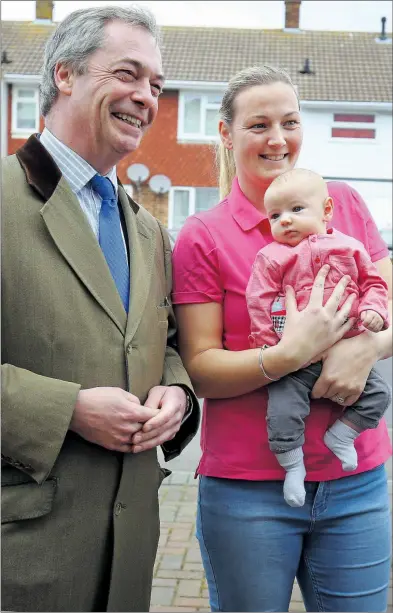  ??  ?? Jubilant Ukip leader Nigel Farage chats to a mum yesterday while campaignin­g in Broadstair­s, Kent