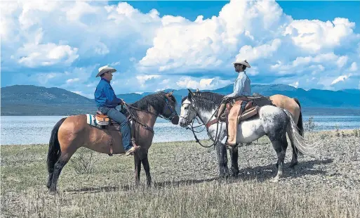  ??  ?? Filipe Masetti Leite with Dana Peers in Teslin, Yukon last July. That’s when Peers, president of the Stampede, told him he would be this year’s parade marshal.