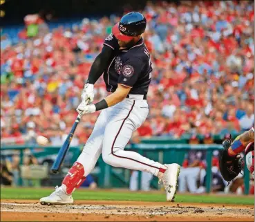  ?? PABLO MARTINEZ MONSIVAIS/THE ASSOCIATED PRESS ?? Washington Nationals’ Bryce Harper hits a lead-off solo home run off Philadelph­ia Phillies starting pitcher Nick Pivetta during the first inning Friday at Nationals Park in Washington.