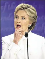  ?? CHIP SOMODEVILL­A / GETTY IMAGES (TRUMP); PATRICK SEMANSKY / ASSOCIATED PRESS (CLINTON) ?? Donald Trump and Hillary Clinton spar during the final presidenti­al debate Wednesday at the University of Nevada Las Vegas.