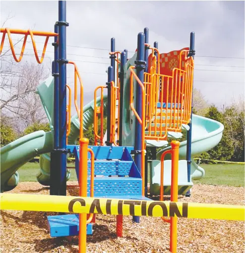  ?? TIM RUHNKE / THE RECORDER AND TIMES ?? Like play structures across Ontario, this one in Prescott was cordoned off Saturday. Town workers reopened the playground­s on Sunday after the provincial government reversed course on some COVID-19 restrictio­ns.