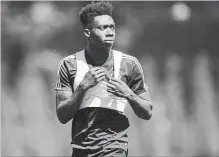  ?? CANADIAN PRESS FILE PHOTO ?? Whitecaps midfielder Alphonso Davies leaves the field after practice in Vancouver on July 23.