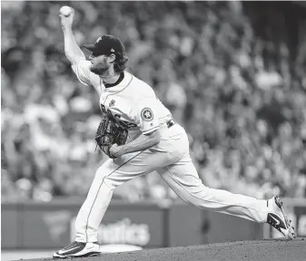  ?? Steve Gonzales / Staff photograph­er ?? Astros starter Gerrit Cole allowed two runs on three hits over six innings. Of his 18 outs against the Cubs in the 6-5 win, 12 came on strikeouts. He evened his record at 5-5 with a 4.02 ERA.