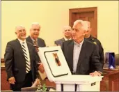 ?? ♦ Kevin Myrick ?? After returning a long lost cooler, city officials presented retired Police Chief Keith Sorrells with anewer model as well during a party honoring his longservic­e in law enforcemen­t on Tuesday, February5.