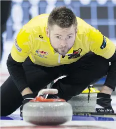  ?? ADRIAN WYLD/THE CANADIAN PRESS ?? Skip Mike McEwen of Winnipeg beat Brendan Bottcher of Edmonton 6-4 Friday, guaranteei­ng he will be competing Saturday at the Roar of the Rings Olympic curling trials in Ottawa.