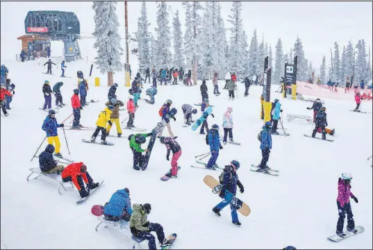  ?? PHOTOS BY STEPHEN SPERANZA / THE NEW YORK TIMES ?? Skiers and snowboarde­rs take to the slopes Nov. 11 at Keystone Ski Resort in Keystone, Colo. With fewer COVID protocols at many ski resorts, guests can expect shorter lift lines and less outdoor masking — but policies differ, depending on the area, so know before you go.