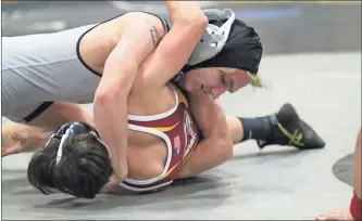  ?? / Scott Herpst ?? Ridgeland’s Chris Prescott rolls over his Dade County opponent on his way to a pin in the 126-pound bout during Friday’s Senior Night victory. The Panthers also scored a big win over Northwest later in the night.