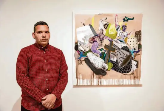 ?? Photos by Salgu Wissmath/The Chronicle ?? SECA Art Award recipient Gregory Rick, an Army veteran, uses large-scale paintings to address themes of racial conflict, battle, protest and systemic injustices.
