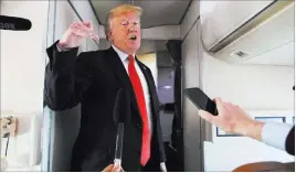  ?? Manuel Balce Ceneta ?? The Associated Press President Donald Trump speaks to reporters Friday on Air Force One. He announced the date he will reveal his Supreme Court nominee to replace Justice Anthony Kennedy.