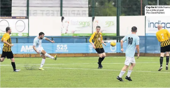  ??  ?? Cup for it Eddie Fearns has a strike at goal.
(Pics: David Rankin)