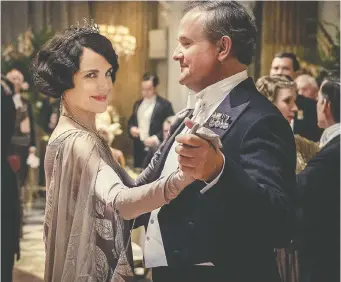  ?? FOCUS FEATURES ?? Actor Hugh Bonneville, right, seen in 2019's Downton Abbey movie alongside his co-star Elizabeth McGovern, says the cast “would love to do” a followup when it's sensible to begin filming.